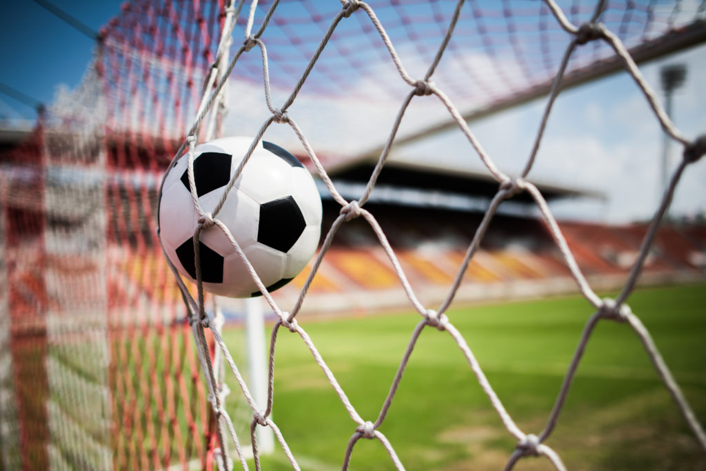 Soccer into goal success concept
